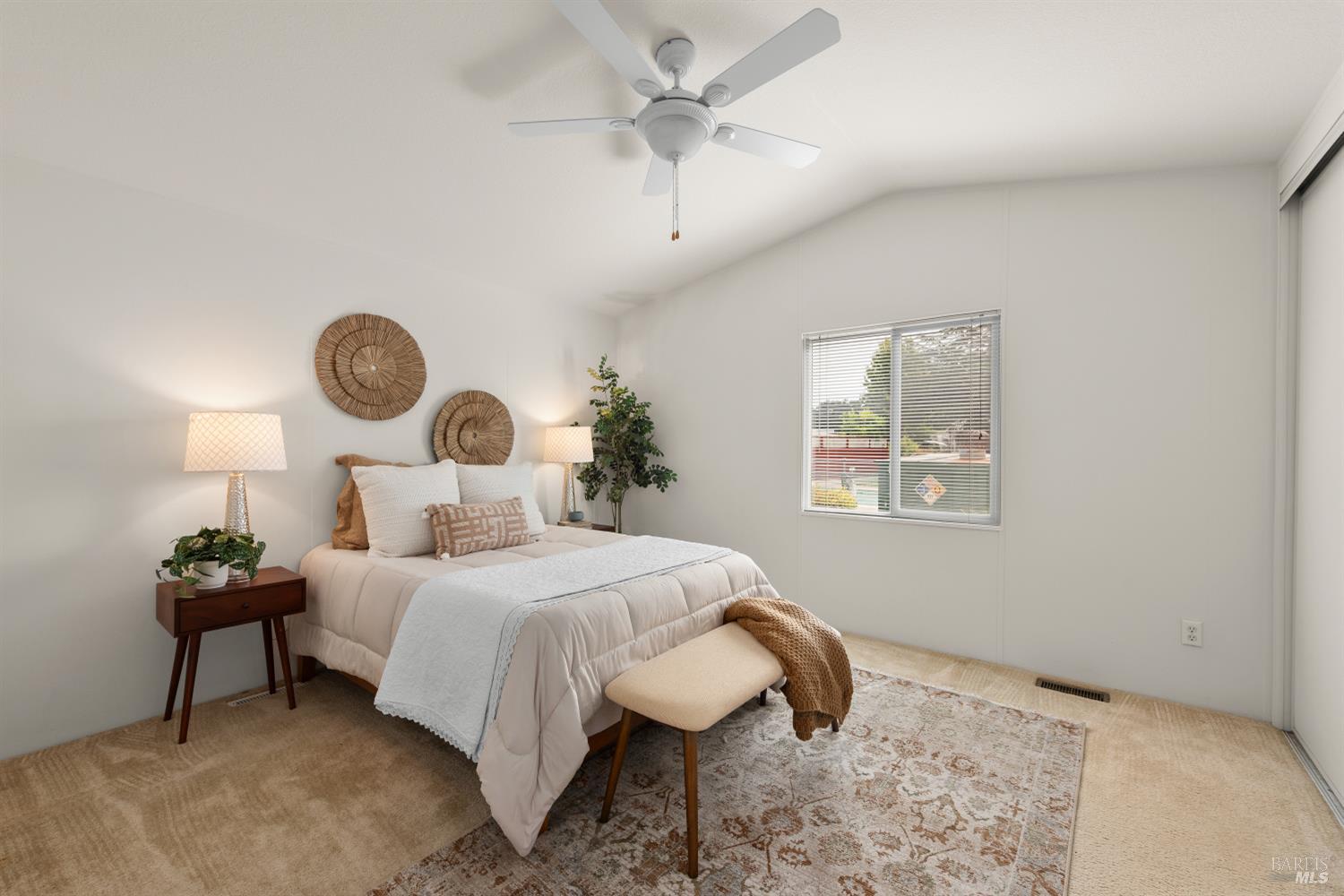 5754 Lois Avenue Santa Rosa, CA 95403 - Photo 17 of 23 a bedroom with a bed and a chandelier