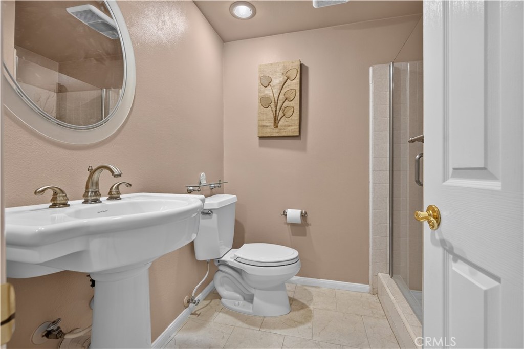 11719 Monte Leon Way Porter Ranch, CA 91326 - Photo 25 of 56 bathroom at downstairs with bath tubb