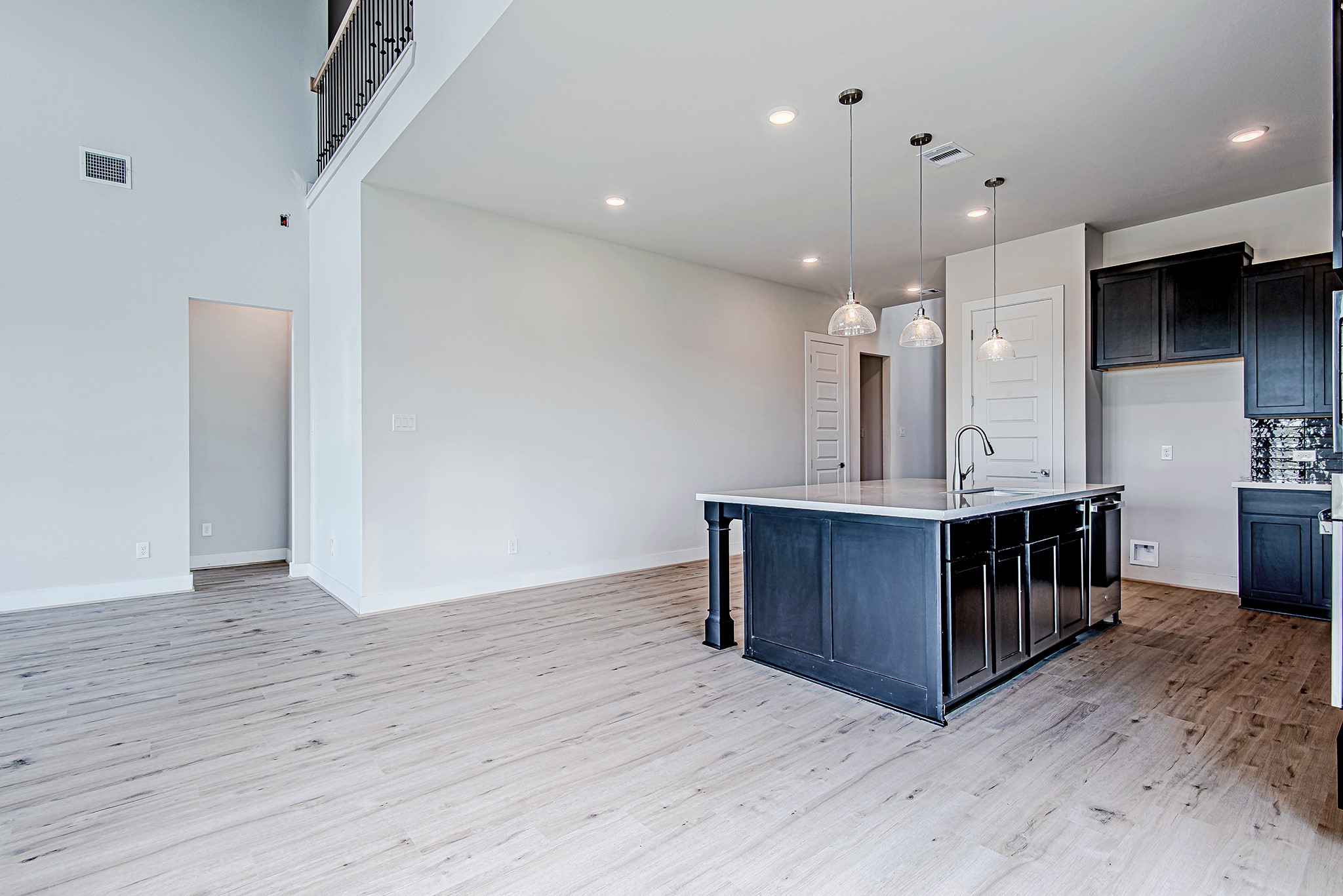 177 Peninsula Point Drive Montgomery, TX 77356 - Photo 40 of 40 Open-concept floorplan with soaring ceilings and continuous wood-look flooring creates an ideal space for entertaining and everyday living.