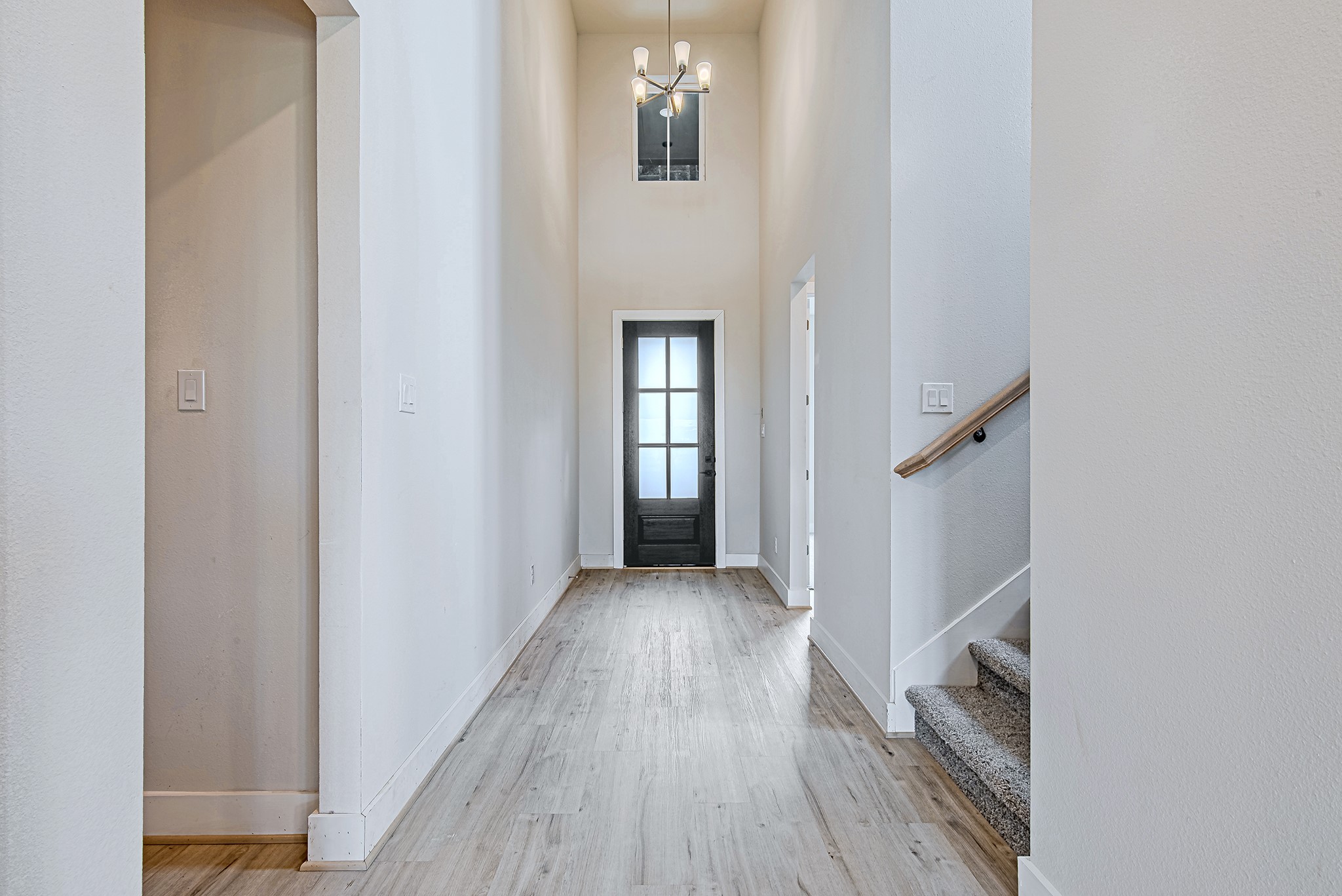 177 Peninsula Point Drive Montgomery, TX 77356 - Photo 7 of 40 A view back toward the front entry reveals the impressive height and architectural details that define this elegant space.