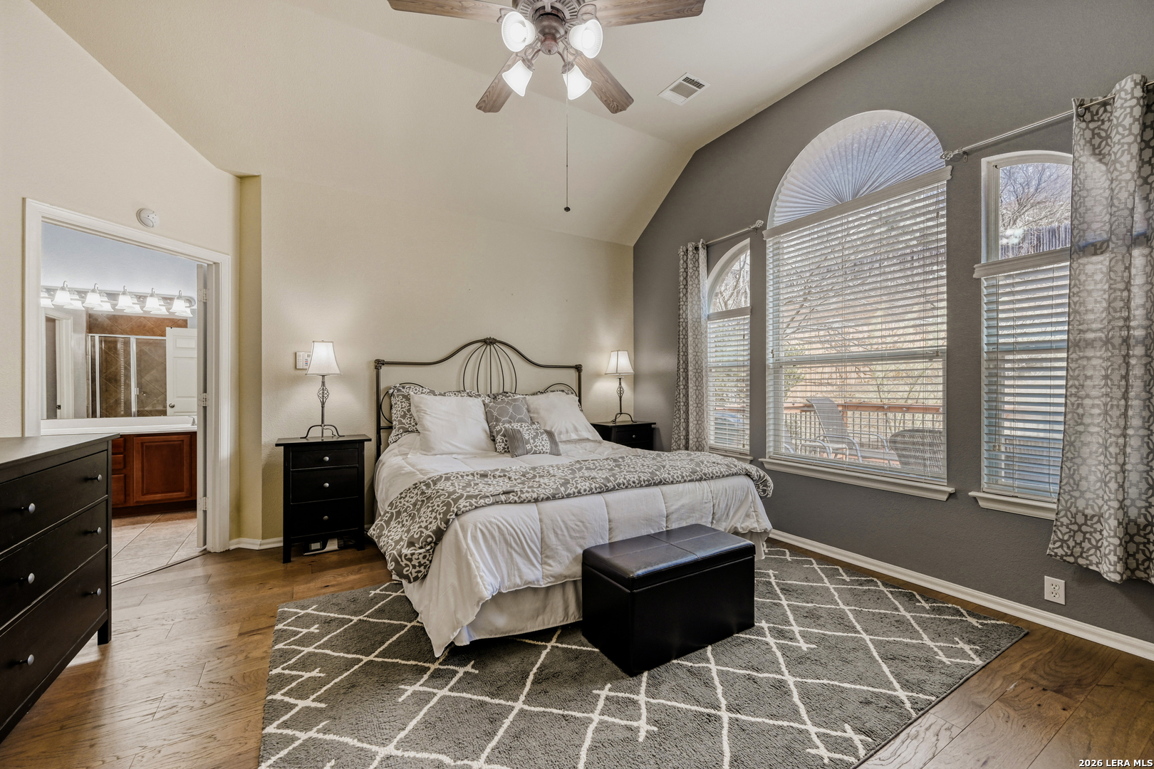 10539 Rainbow View Helotes, TX 78023 - Photo 11 of 24 a bedroom with a large bed and a window