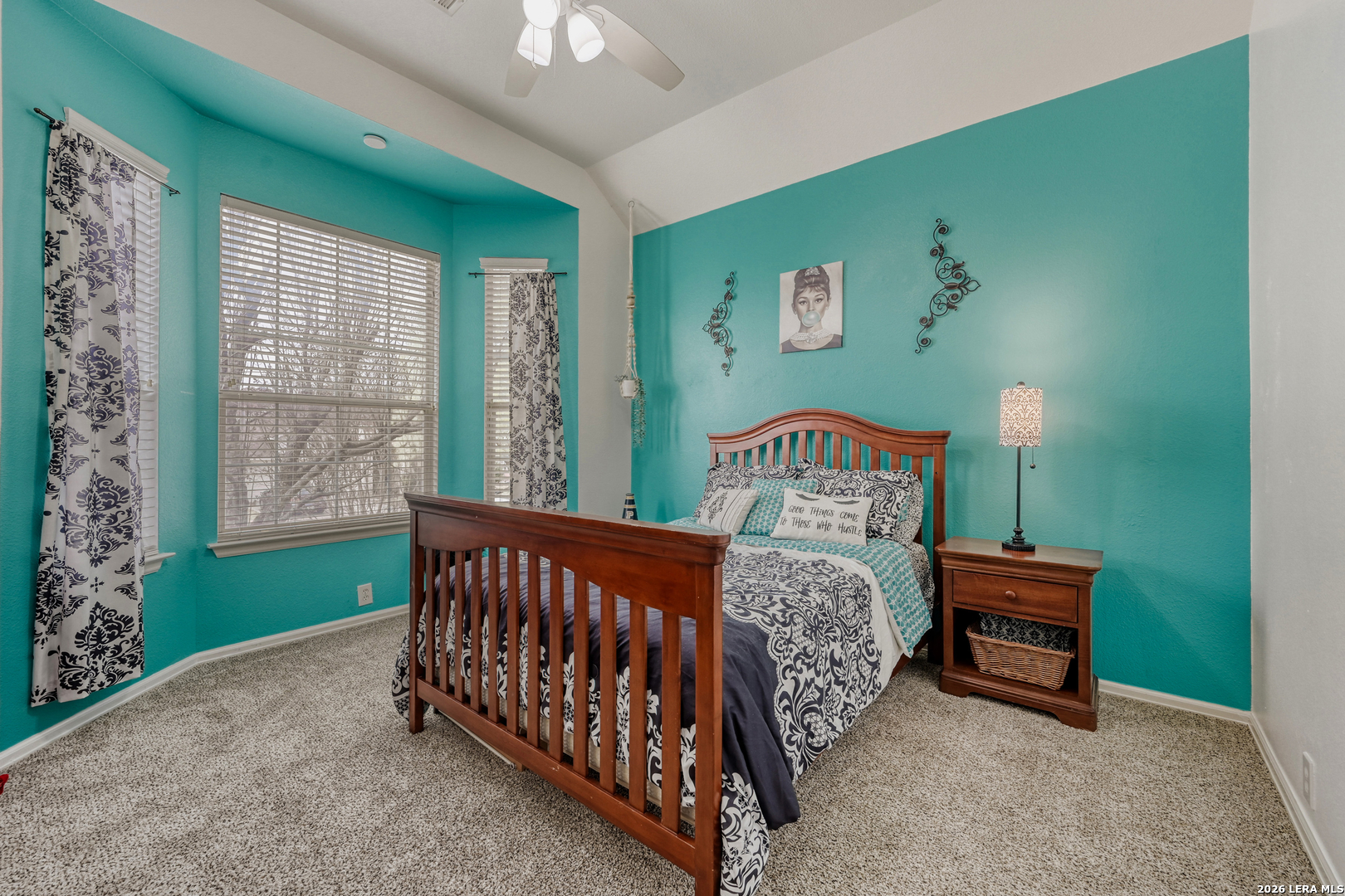 10539 Rainbow View Helotes, TX 78023 - Photo 17 of 24 a bed sitting in a bedroom next to a window