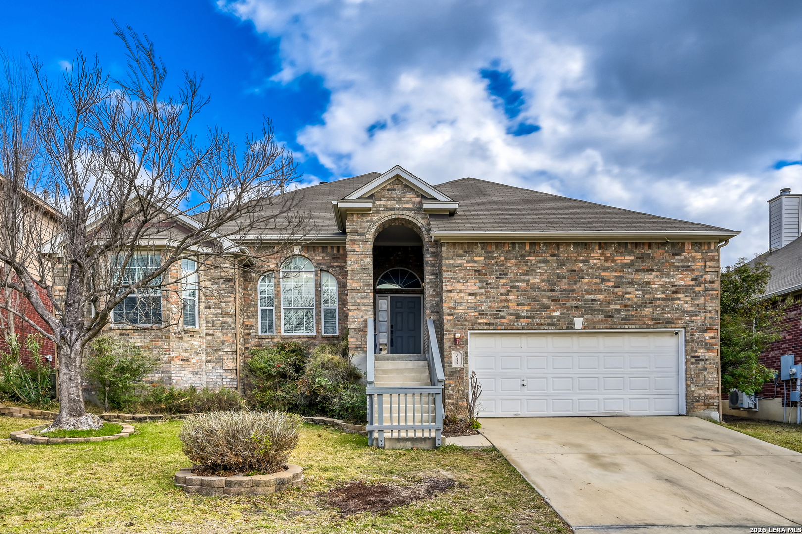 10539 Rainbow View Helotes, TX 78023 - Photo 2 of 24 a front view of a house with garden