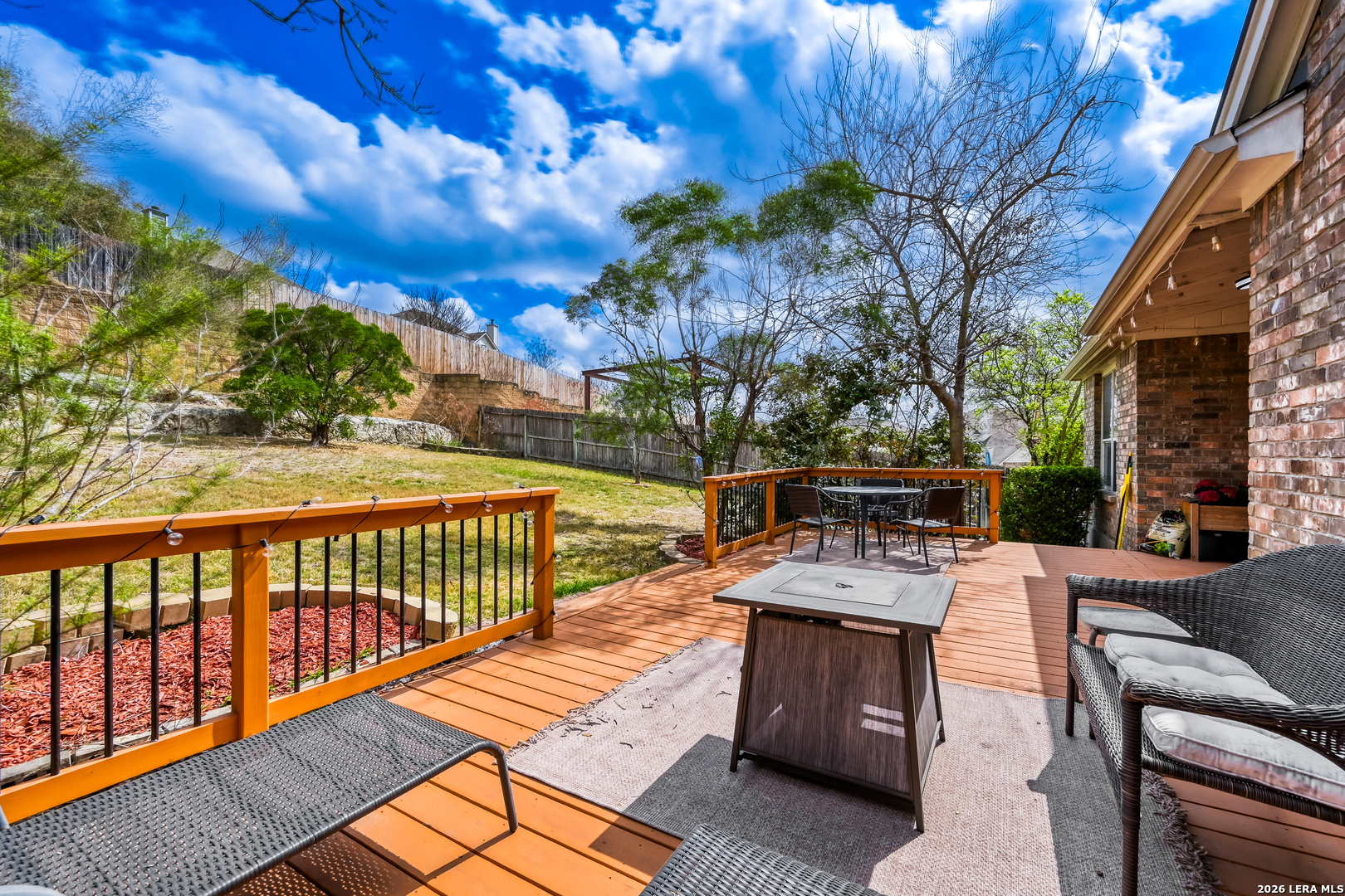 10539 Rainbow View Helotes, TX 78023 - Photo 22 of 24 a view of a patio with couches and wooden floor