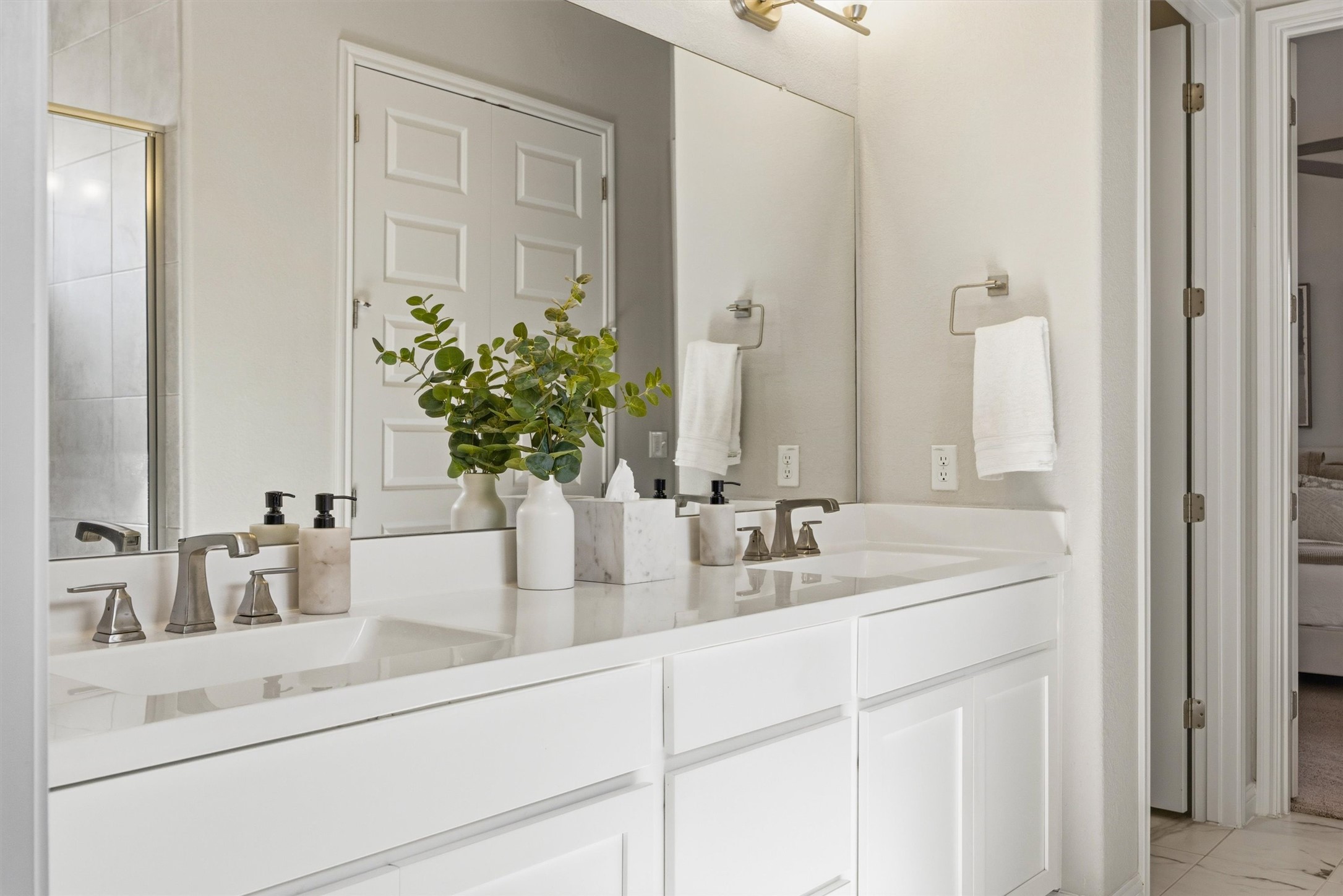 7905 Corrigan Pass Austin, TX 78744 - Photo 20 of 36 The primary bathroom features dual vanities for added convenience.