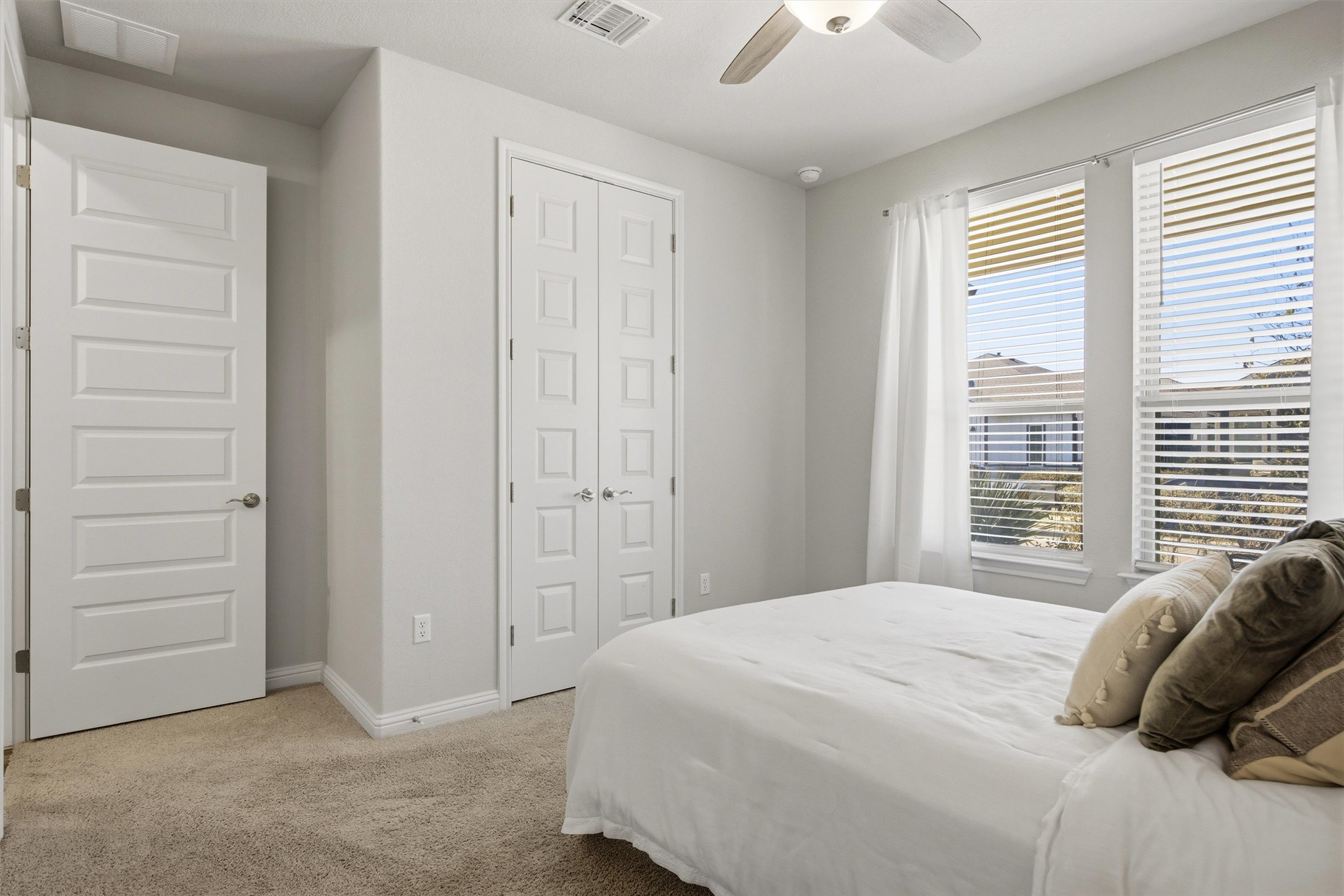 7905 Corrigan Pass Austin, TX 78744 - Photo 27 of 36 Bright windows allow natural light to fill the guest bedrooms.