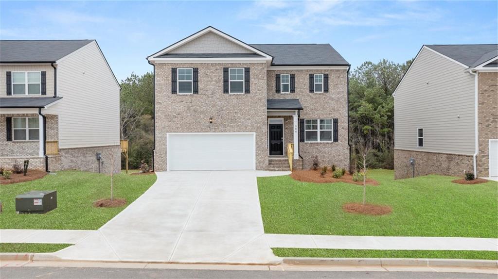 608 Whitman Lane Stockbridge, GA 30281 - Photo 1 of 1 a front view of a house with a yard