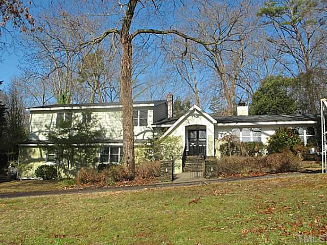 1919 Highland Place Raleigh, NC 27607 - Photo 1 of 19 front view of a house with a yard