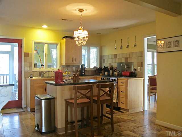1919 Highland Place Raleigh, NC 27607 - Photo 12 of 19 a view of a dining room with furniture and wooden floor