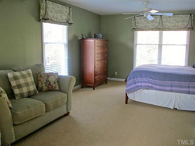 1919 Highland Place Raleigh, NC 27607 - Photo 14 of 19 a bed room with a bed and a window