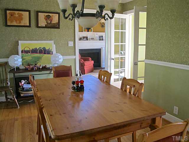 1919 Highland Place Raleigh, NC 27607 - Photo 7 of 19 a view of a dining room with furniture and wooden floor