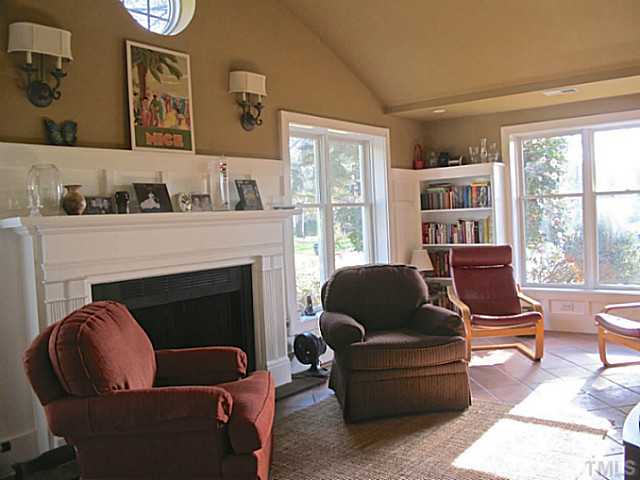 1919 Highland Place Raleigh, NC 27607 - Photo 8 of 19 a living room with furniture and a fireplace