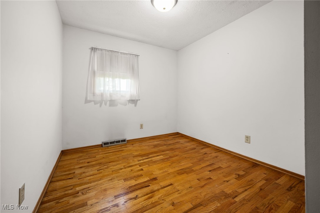 6944 Rolling Ridge Road Northeast Canton, OH 44721 - Photo 16 of 27 Bedroom featuring wood finished floors