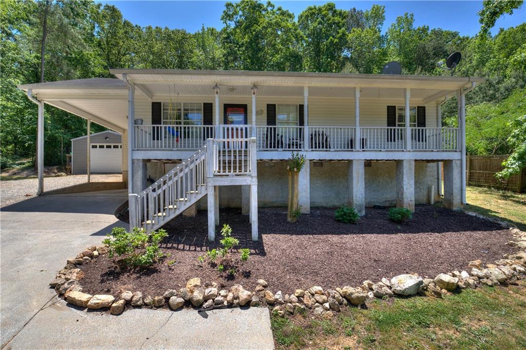 a front view of a house with garden