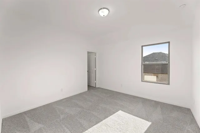 a bathroom with a sink double vanity granite tub shower and a mirror