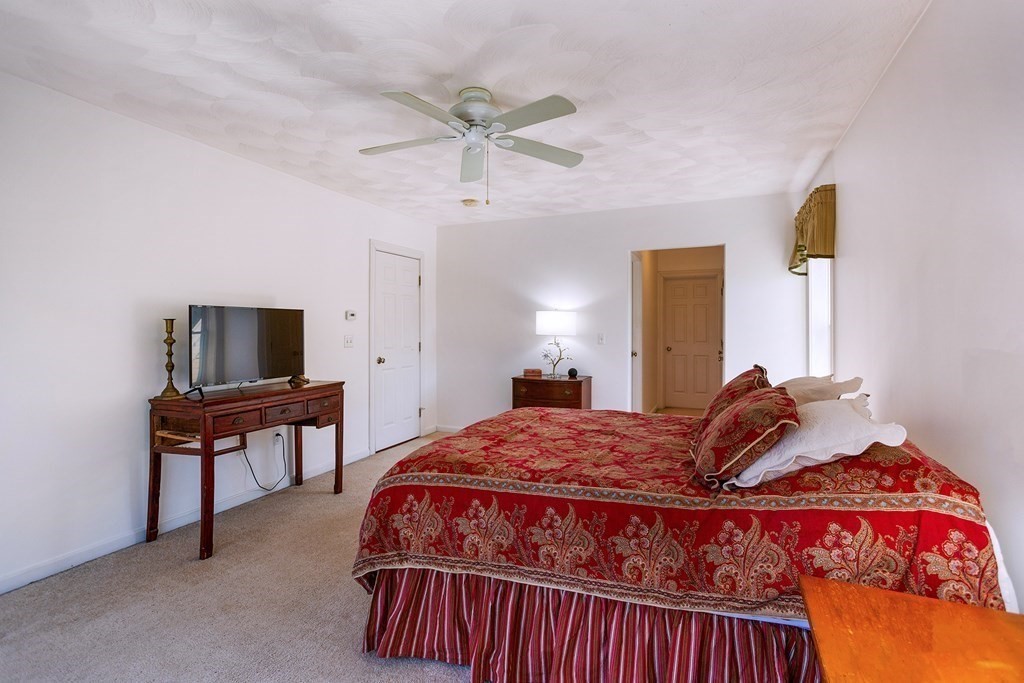 95 Lunenburg Road Townsend, MA 01474 - Photo 17 of 42 a bedroom with a bed and flat screen tv