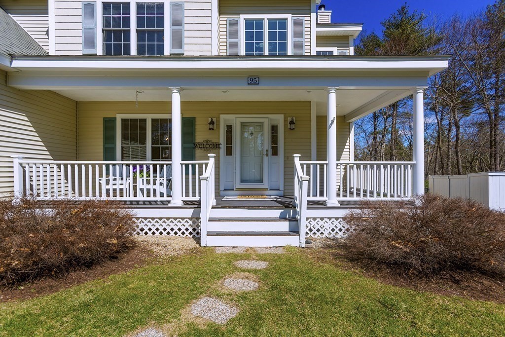 95 Lunenburg Road Townsend, MA 01474 - Photo 27 of 42 a view of a house with a small yard and wooden fence