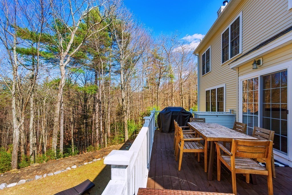 95 Lunenburg Road Townsend, MA 01474 - Photo 28 of 42 a view of a patio with table and chairs with wooden floor and fence