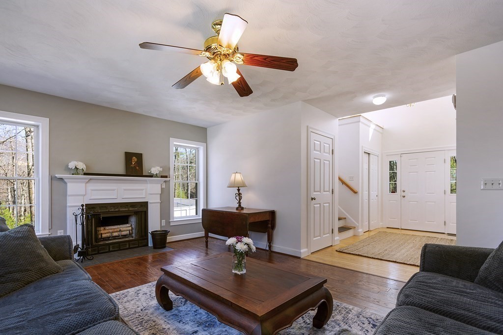 95 Lunenburg Road Townsend, MA 01474 - Photo 4 of 42 a living room with furniture and a fireplace