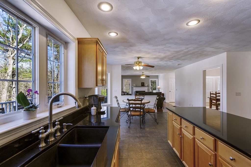 95 Lunenburg Road Townsend, MA 01474 - Photo 5 of 42 a kitchen with sink stove and outdoor view
