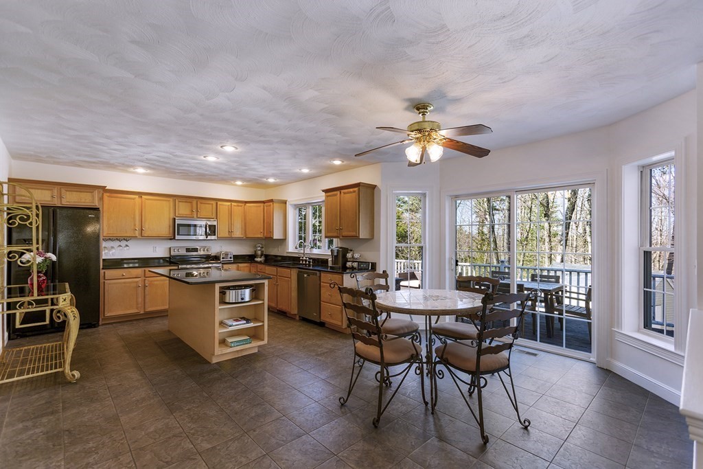 95 Lunenburg Road Townsend, MA 01474 - Photo 8 of 42 a view of a dining room with furniture and a livingroom