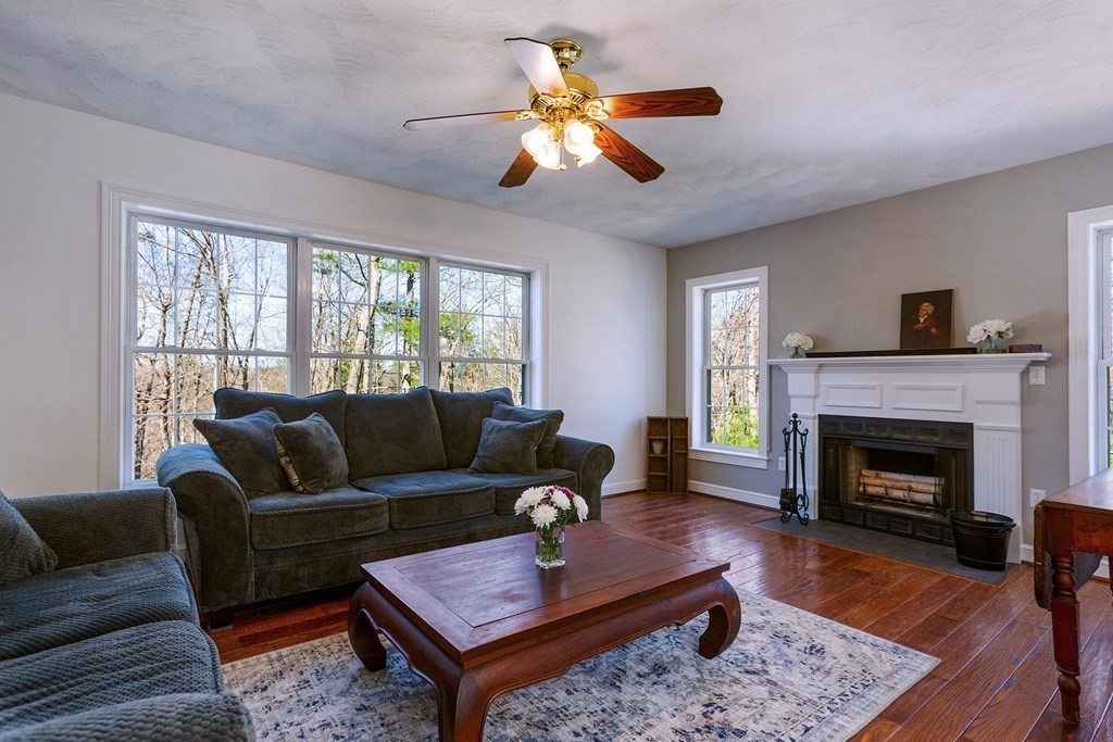 95 Lunenburg Road Townsend, MA 01474 - Photo 10 of 42 a living room with furniture and a fireplace