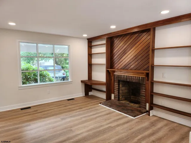 a kitchen with chandelier and window