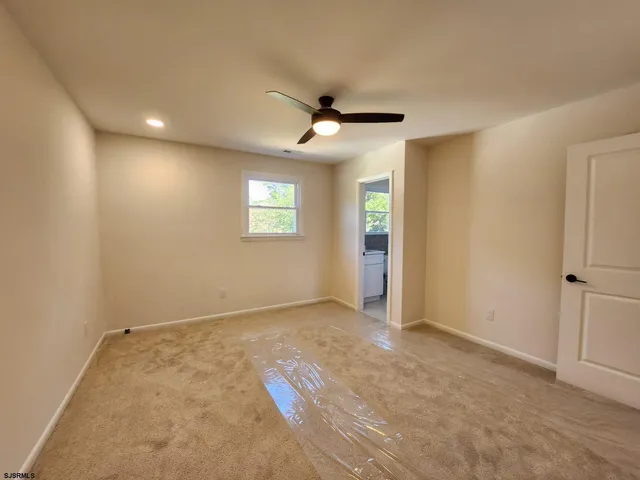 a bathroom with a sink a toilet and bathtub