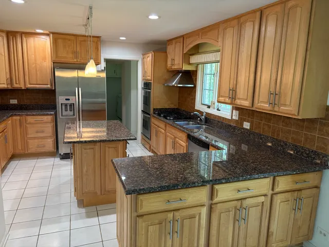 a kitchen with sink and window