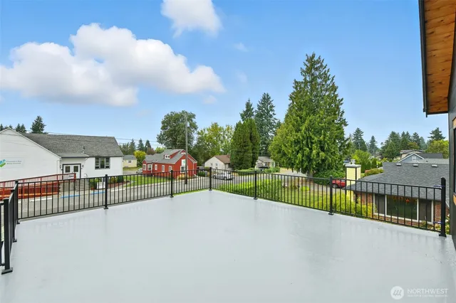a view of a terrace with a bench in front of it