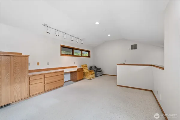 a room with furniture and white walls