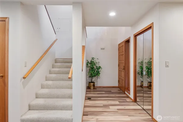 a view of staircase with wooden floor and stairs