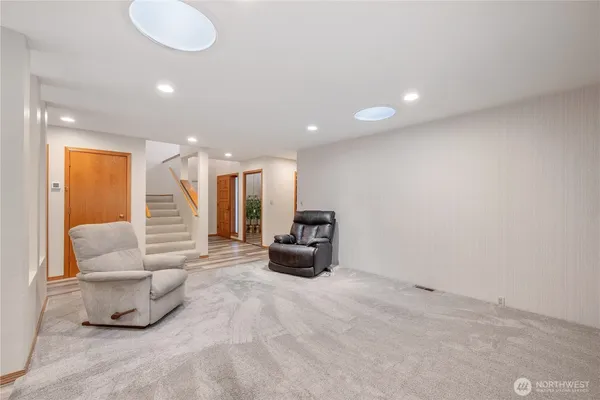 a lobby with furniture and a large window