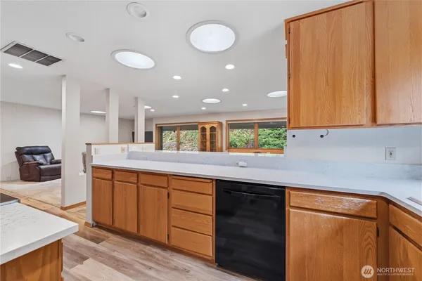 a kitchen with a sink a counter space and appliances