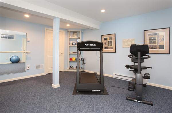68 Pickwick Way, Unit 68 Wayland, MA 01778 - Photo 11 of 15 a view of a room with gym equipment