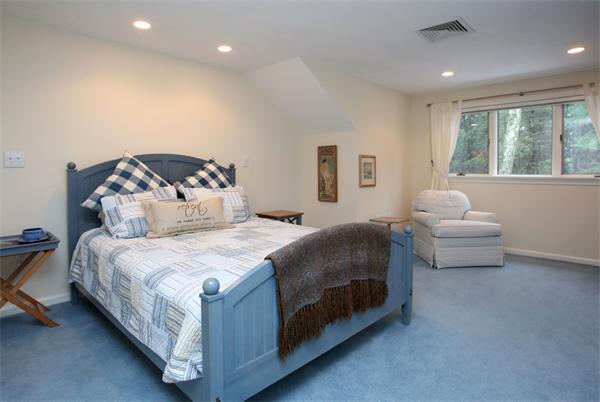 68 Pickwick Way, Unit 68 Wayland, MA 01778 - Photo 9 of 15 a spacious bedroom with a bed and a large window
