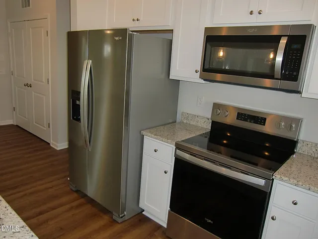 a view of small space with empty racks on the wall