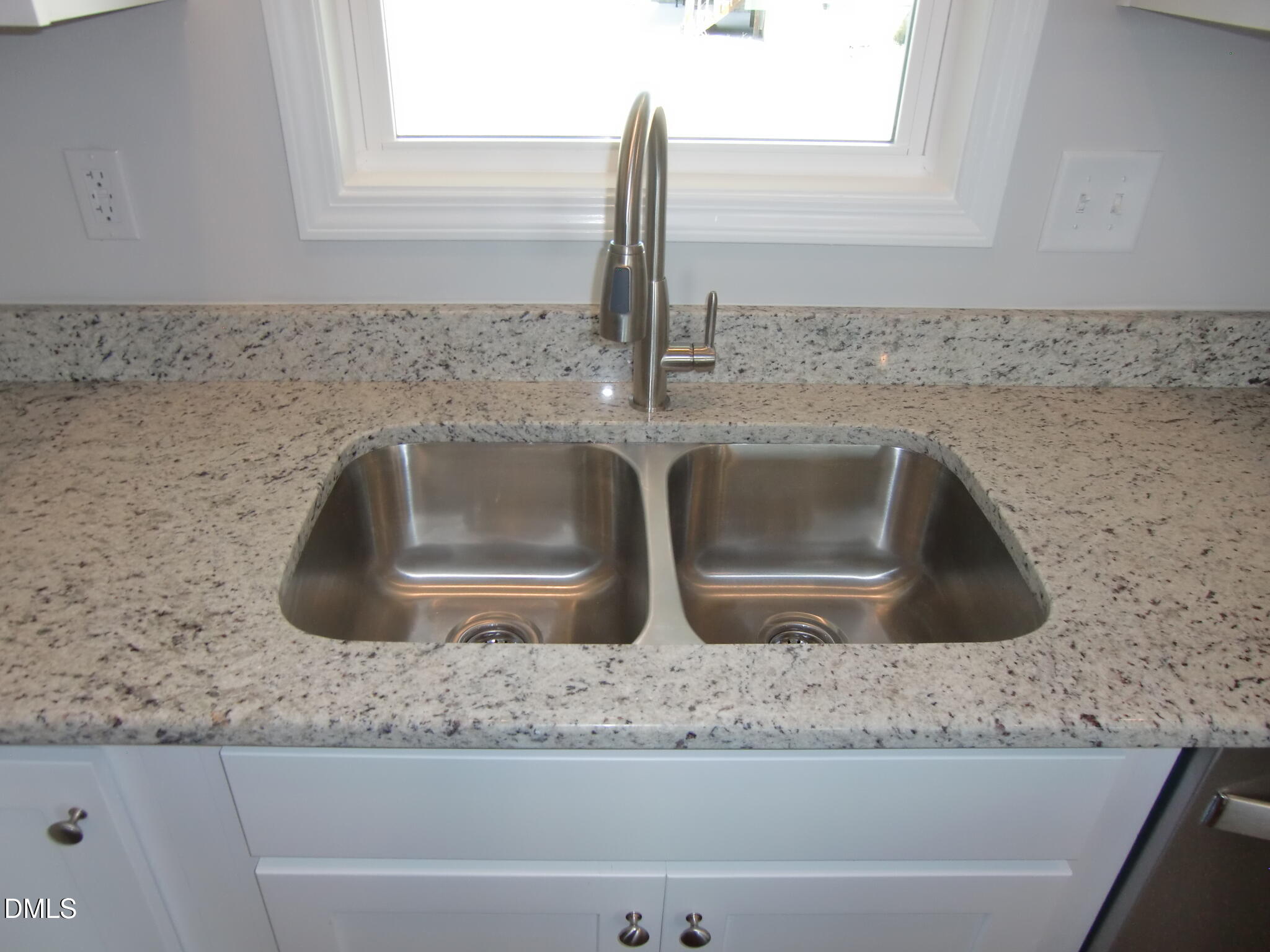 100 Covington Lane Dunn, NC 28334 - Photo 25 of 54 a kitchen sink with granite counter tops and a stove