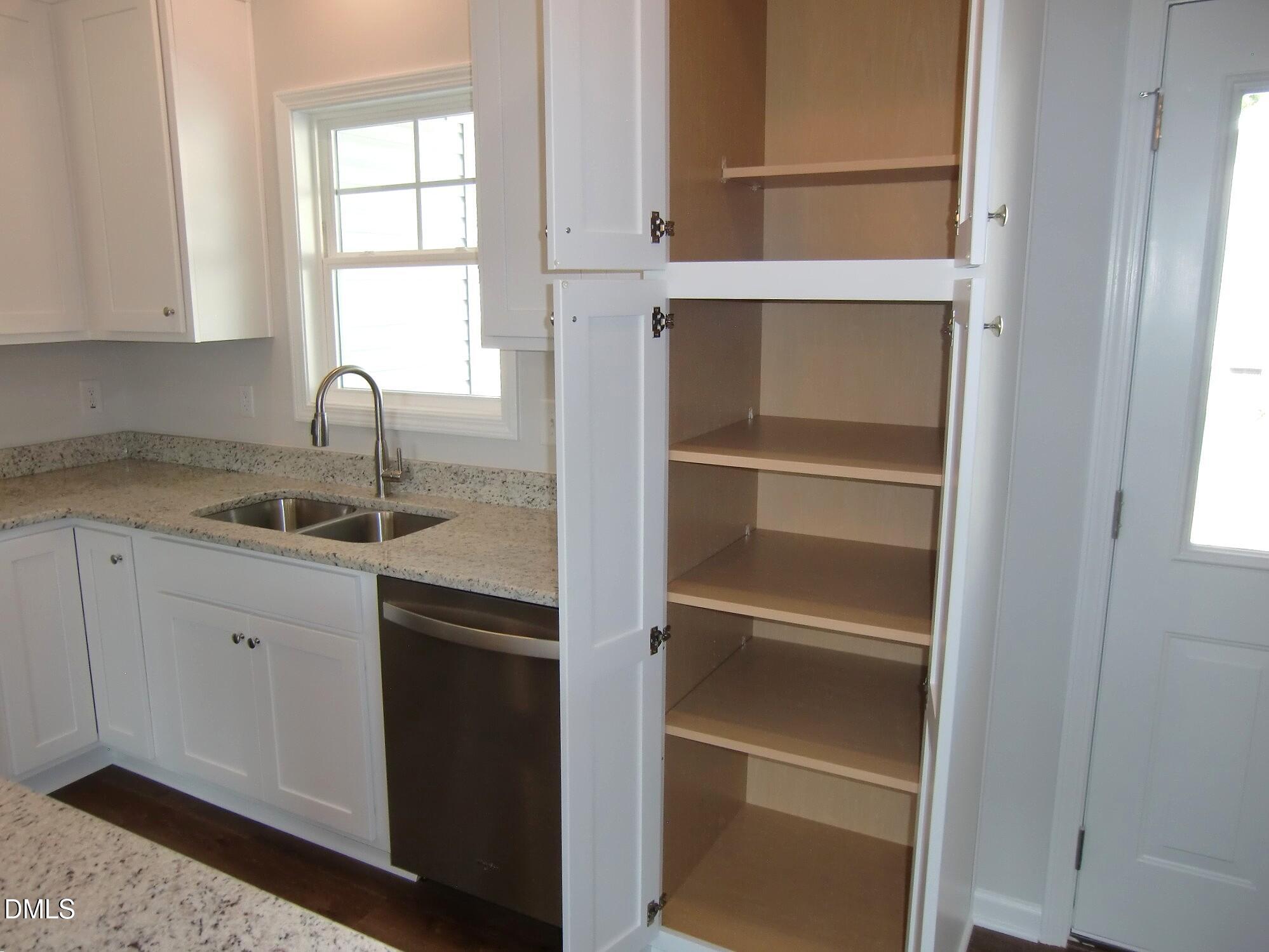 100 Covington Lane Dunn, NC 28334 - Photo 27 of 54 a kitchen with a sink and a window