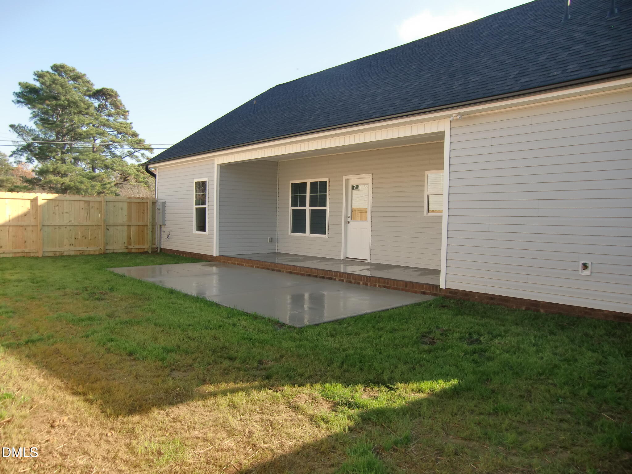 100 Covington Lane Dunn, NC 28334 - Photo 29 of 54 a backyard of a house with lots of green space