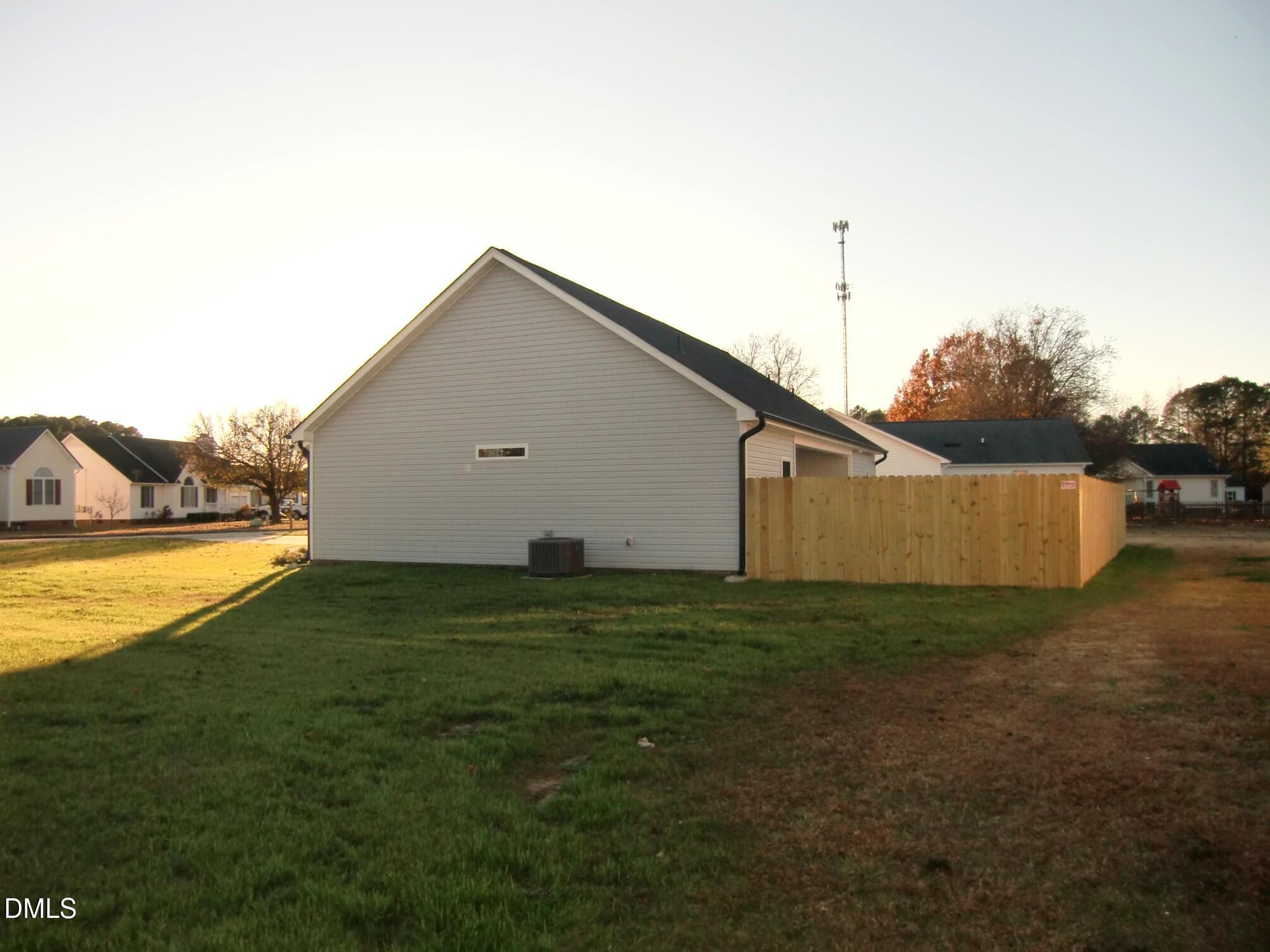 100 Covington Lane Dunn, NC 28334 - Photo 4 of 54 a house view with a outdoor space