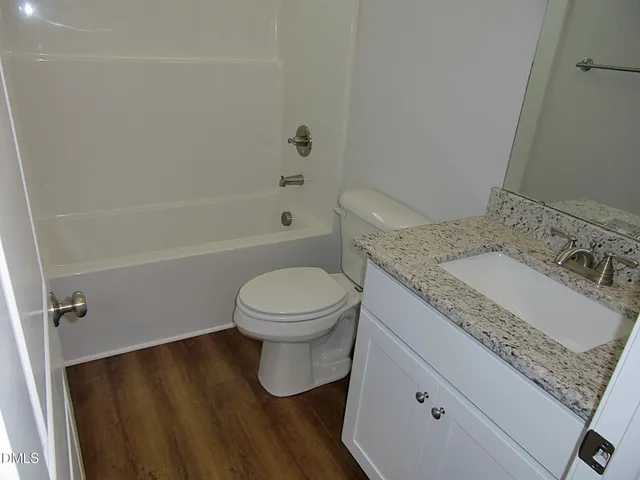 wooden floor and closet in a room