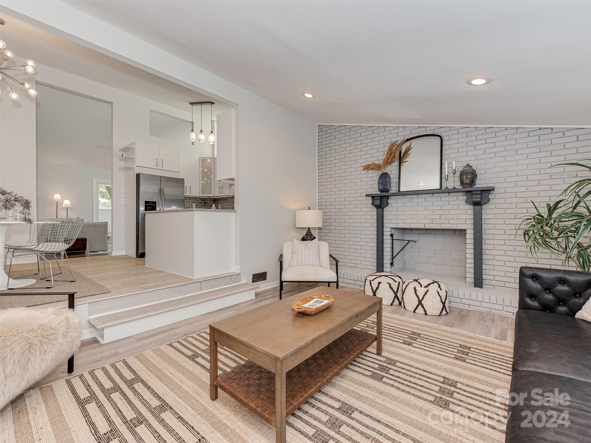 5541 Toano Road Charlotte, NC 28215 - Photo 13 of 35 a living room with furniture and a fireplace