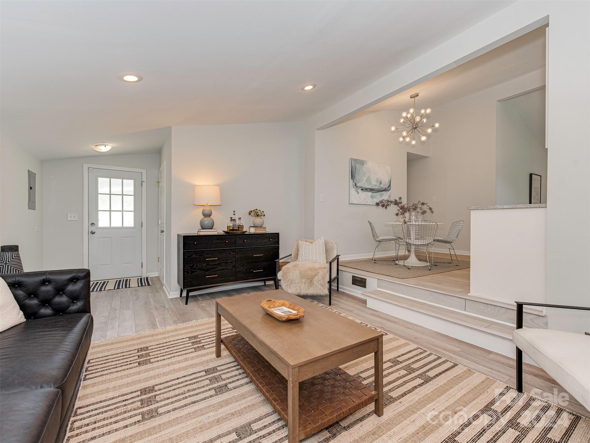 5541 Toano Road Charlotte, NC 28215 - Photo 14 of 35 a living room with furniture and a wooden floor
