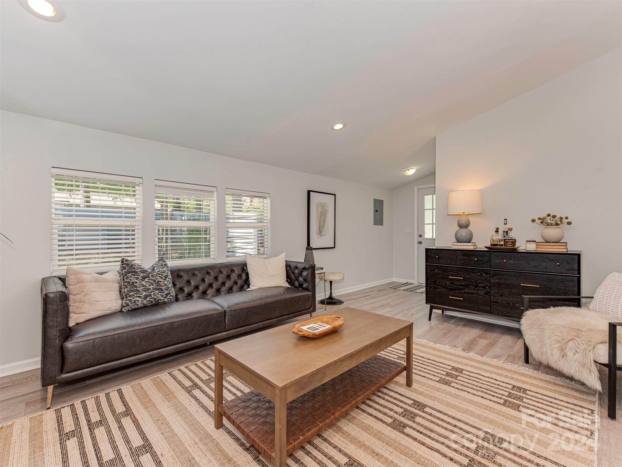 5541 Toano Road Charlotte, NC 28215 - Photo 15 of 35 a living room with furniture and a rug