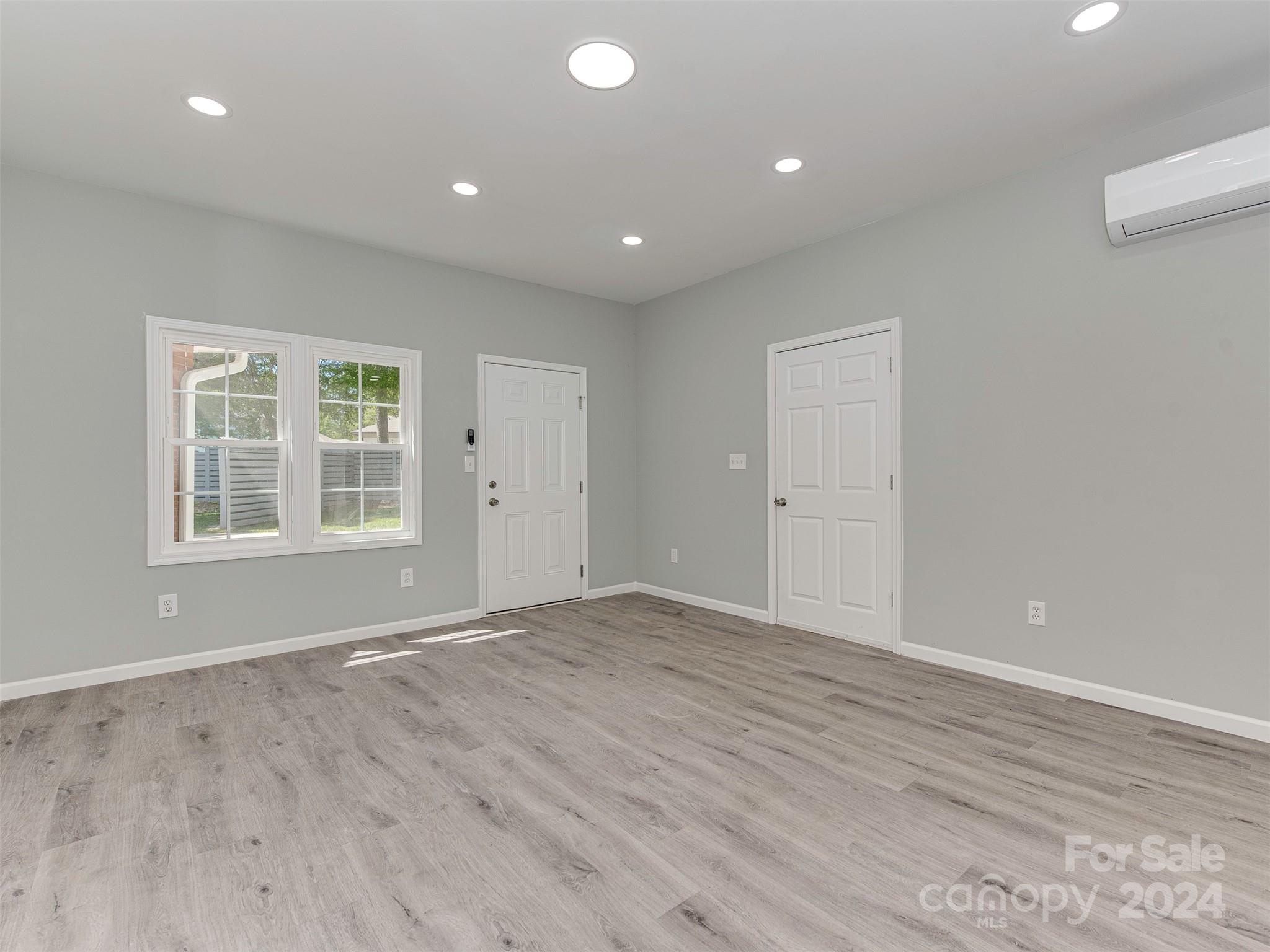5541 Toano Road Charlotte, NC 28215 - Photo 29 of 35 wooden floor in an empty room with a window