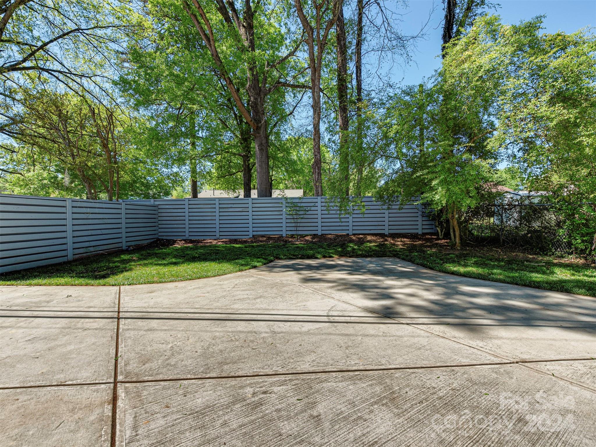 5541 Toano Road Charlotte, NC 28215 - Photo 31 of 35 a view of a yard with wooden fence