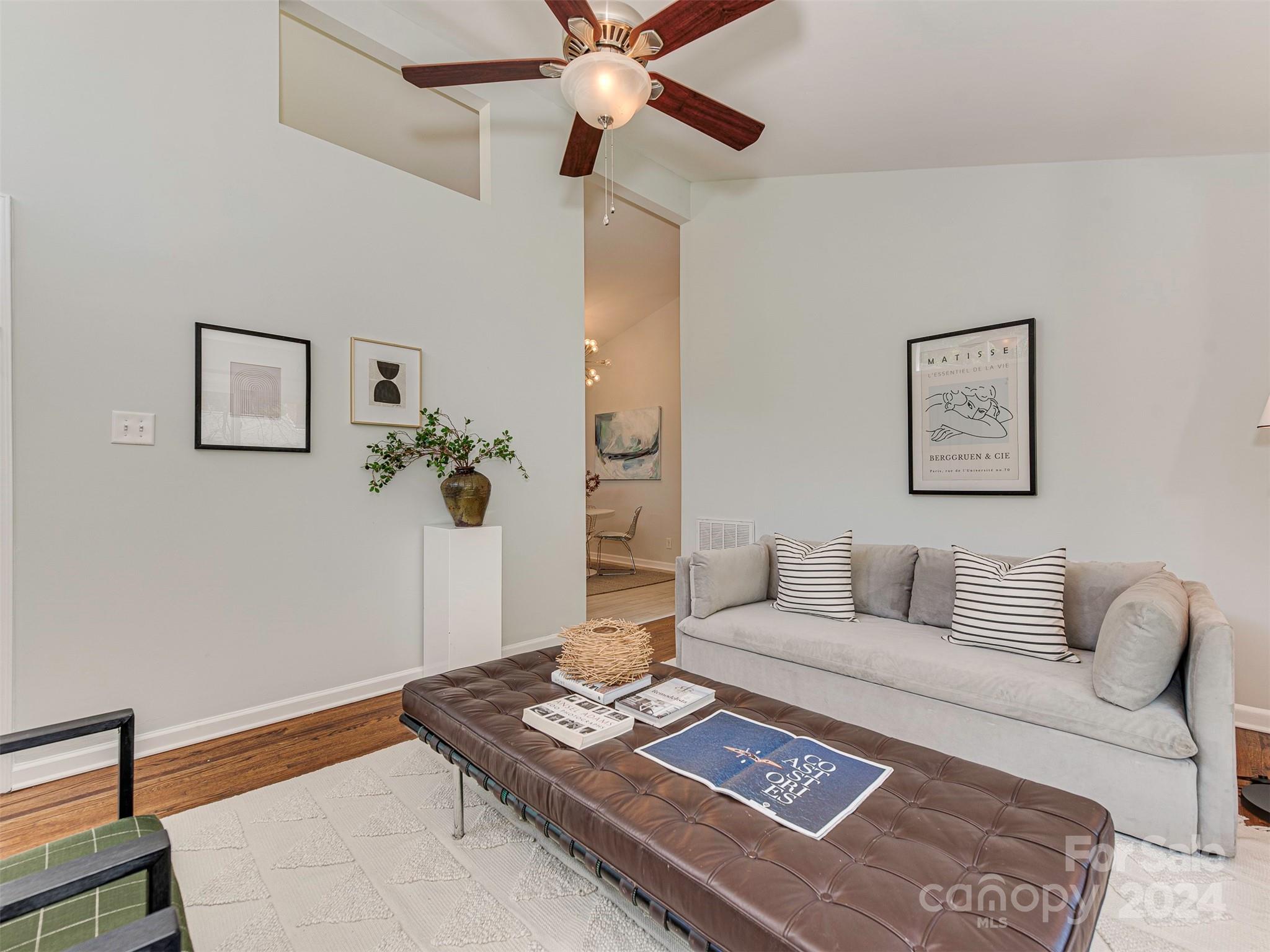 5541 Toano Road Charlotte, NC 28215 - Photo 5 of 35 a living room with furniture and a potted plant