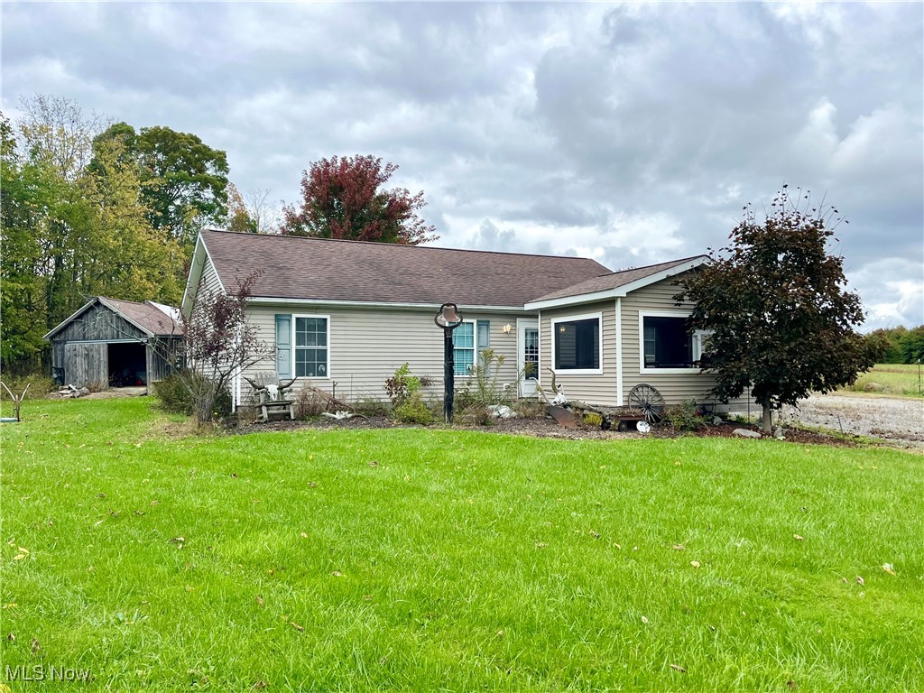 2687 Griggs Road Jefferson, OH 44047 - Photo 1 of 41 Rear view of house featuring a yard
