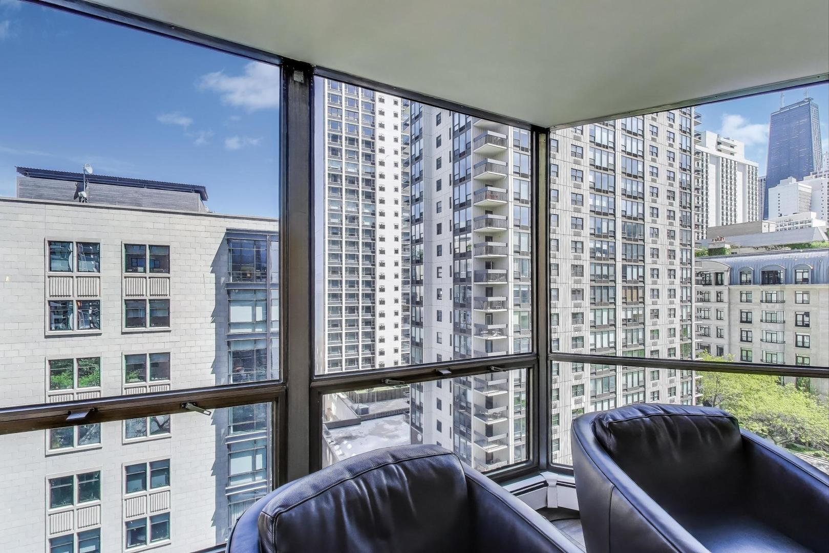 1310 North Ritchie Court, Unit 9D Chicago, IL 60610 - Photo 22 of 27 a view of a balcony with chairs